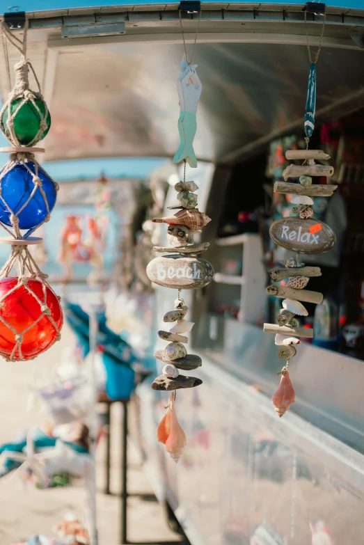 colorful hanging mobiles of various colors and sizes