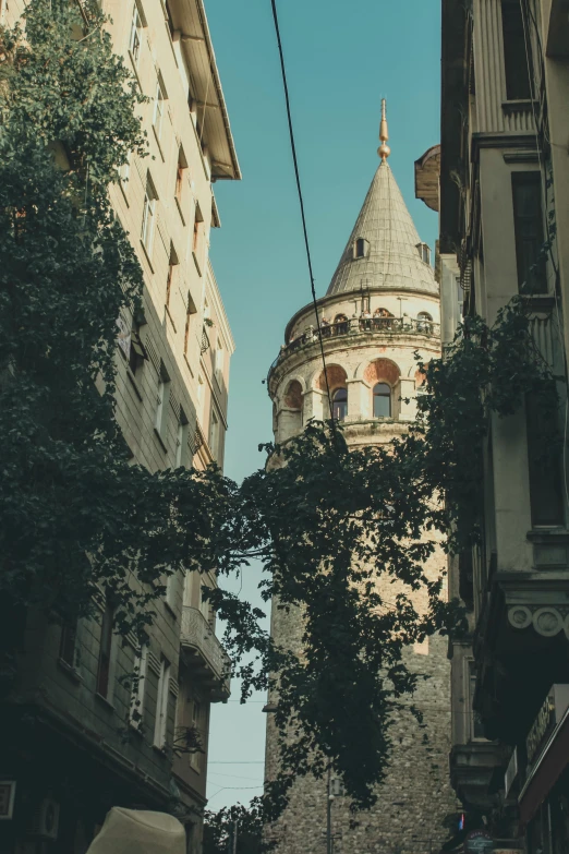 an old building on the corner of a busy street