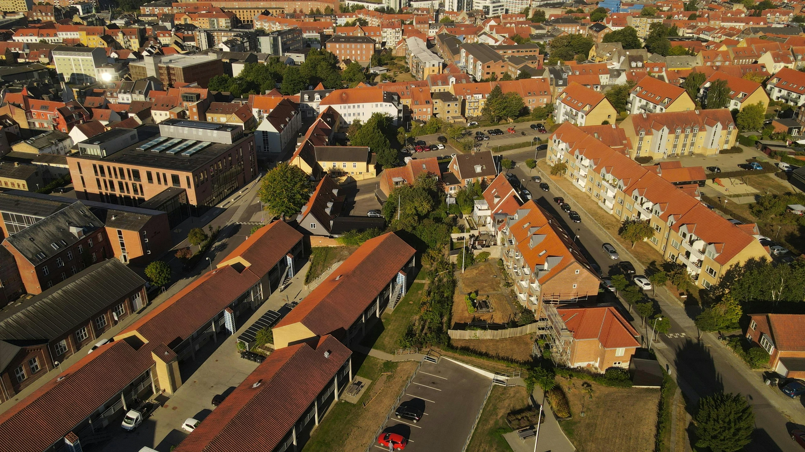 an aerial view of a city with brown roof tiles