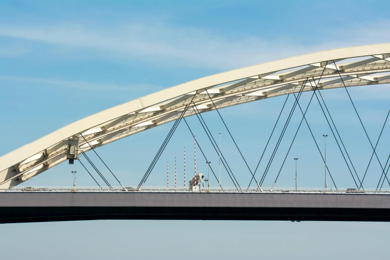 a man on a bridge with a surf board