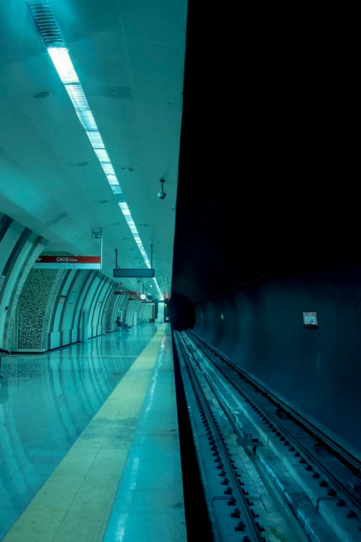 a dimly lit subway station is dimly lit