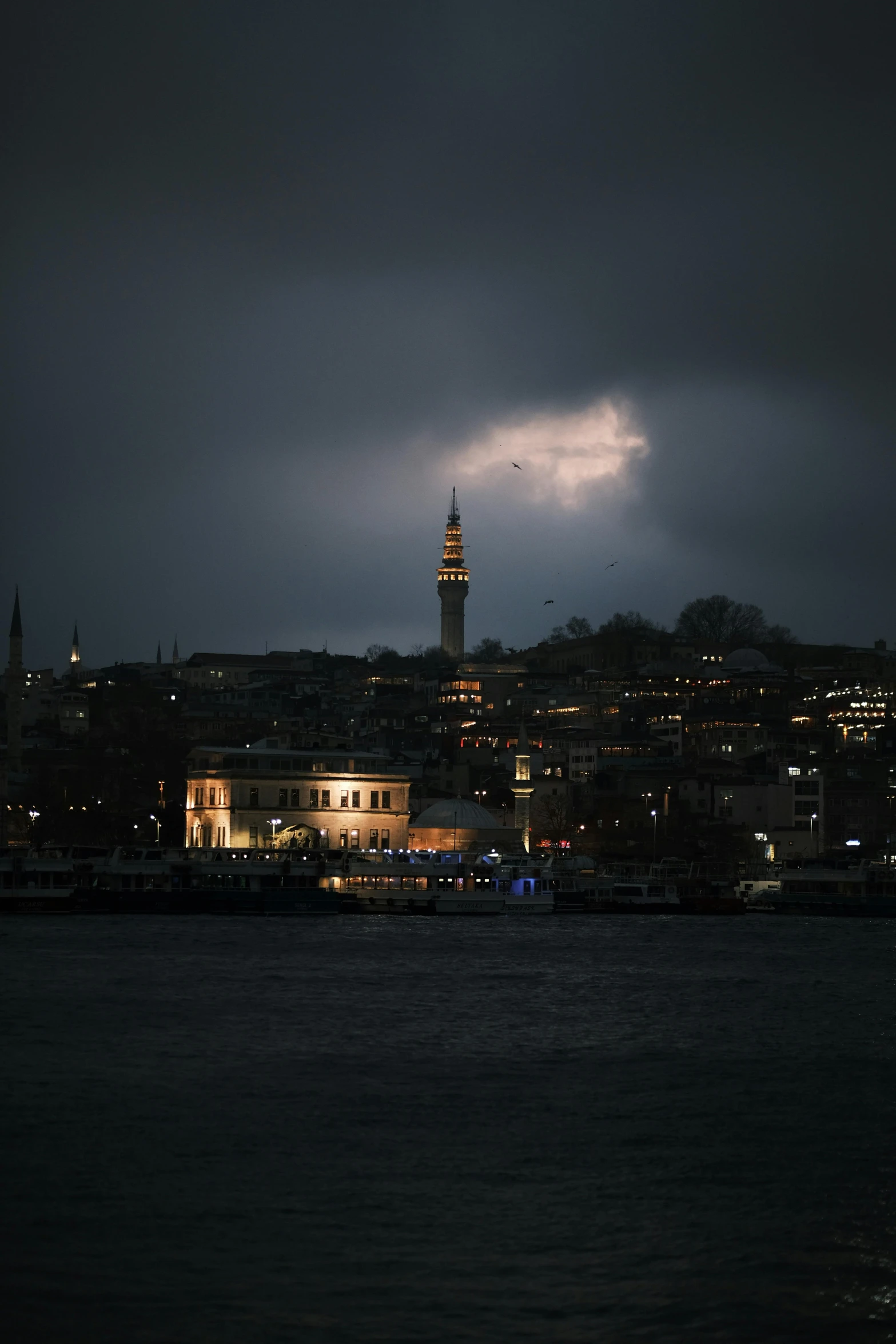 the view of an island with a clock tower in the distance