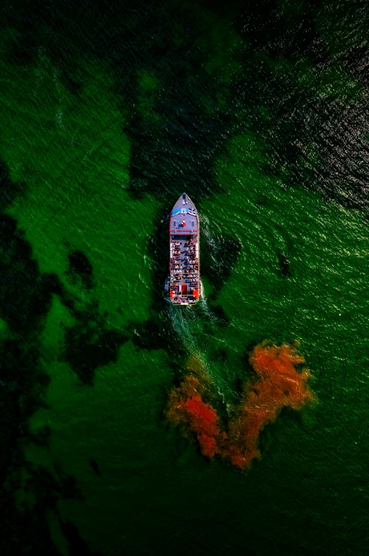 aerial view of a white boat floating in the water