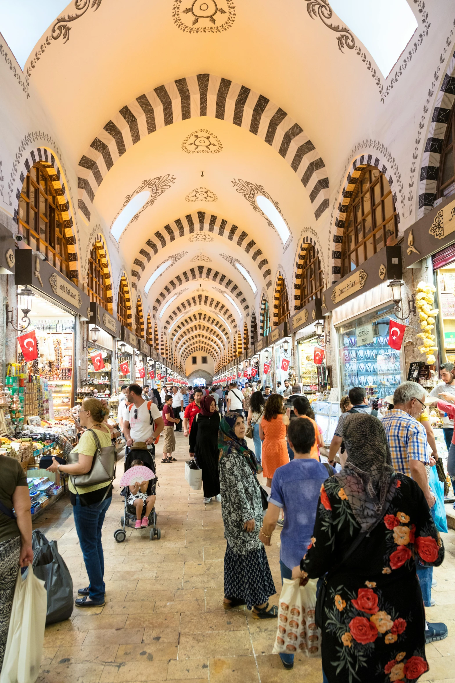 an overhead view of a market where shoppers are seen