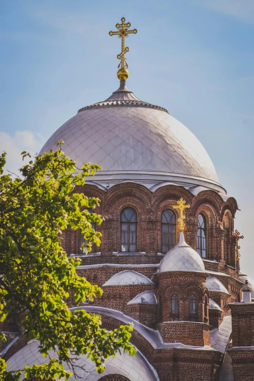 the top of a large building with a cross on it