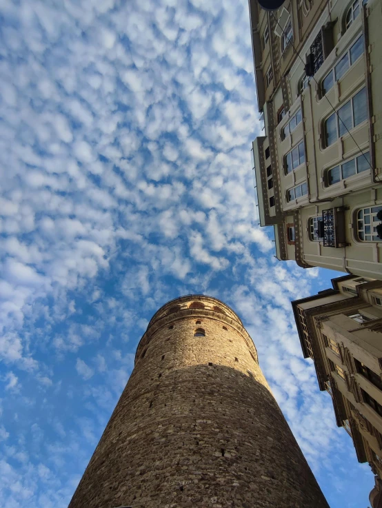 a tall tower with two clocks on it's sides