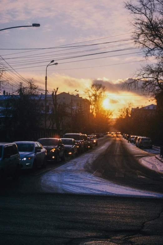 many cars parked at the side of the street