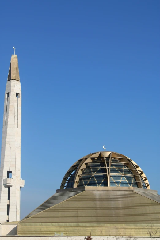 a tall clock tower towering over the top of a building