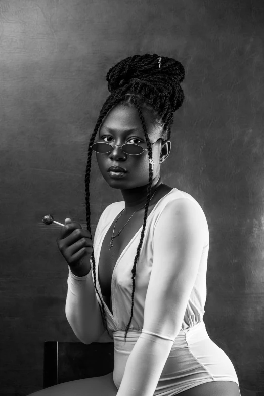 a woman posing with a cigarette while dressed in white