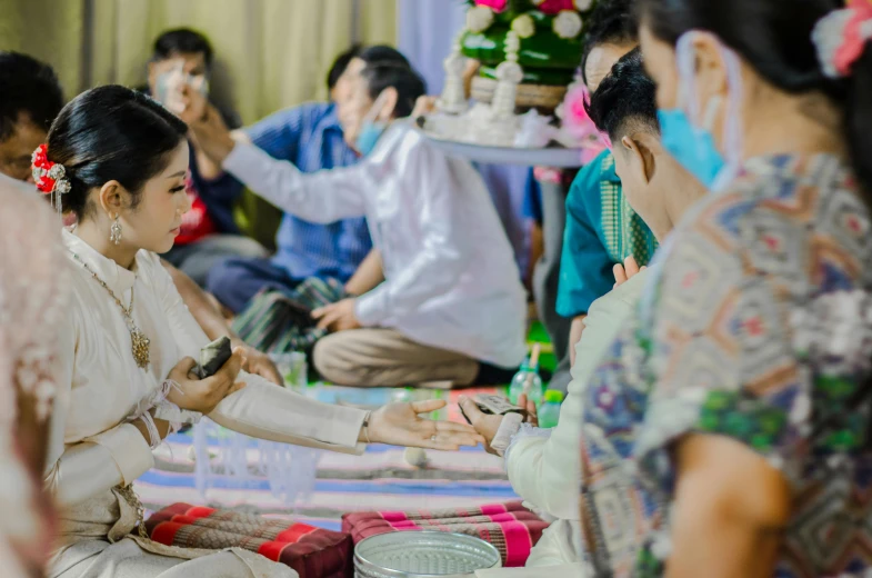 brides during wedding ceremony with others waiting in line