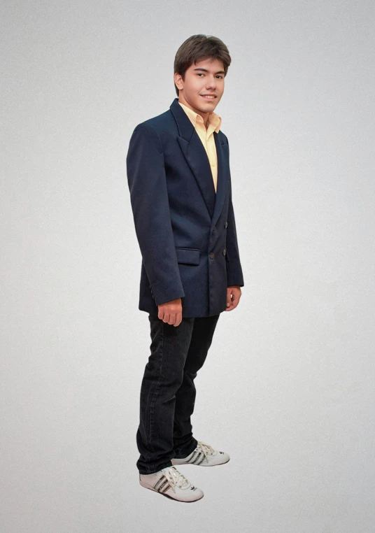 young man in blue suit standing on white background
