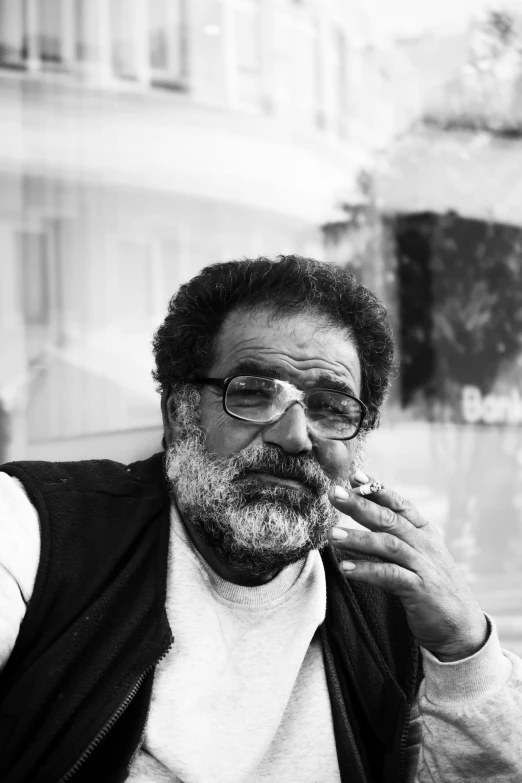 a black and white po of a man smoking