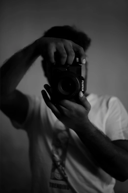 a man taking a po with a camera in a mirror