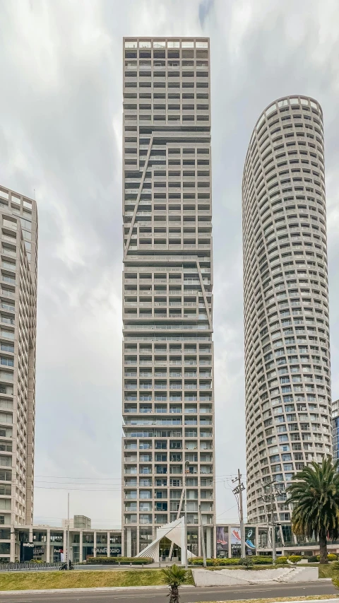 two high rise buildings on a cloudy day