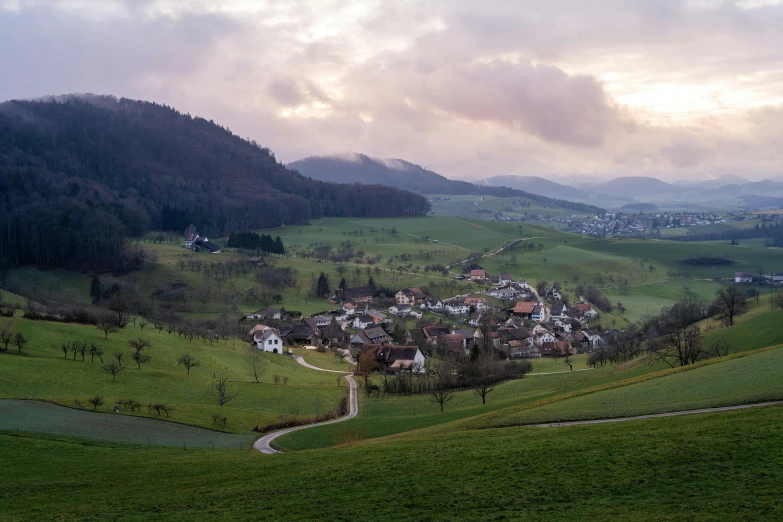 a hilly valley with lush green hills in the background