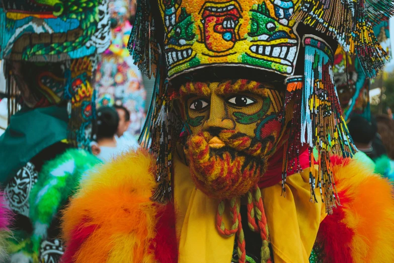 a man that has some feathers on his head