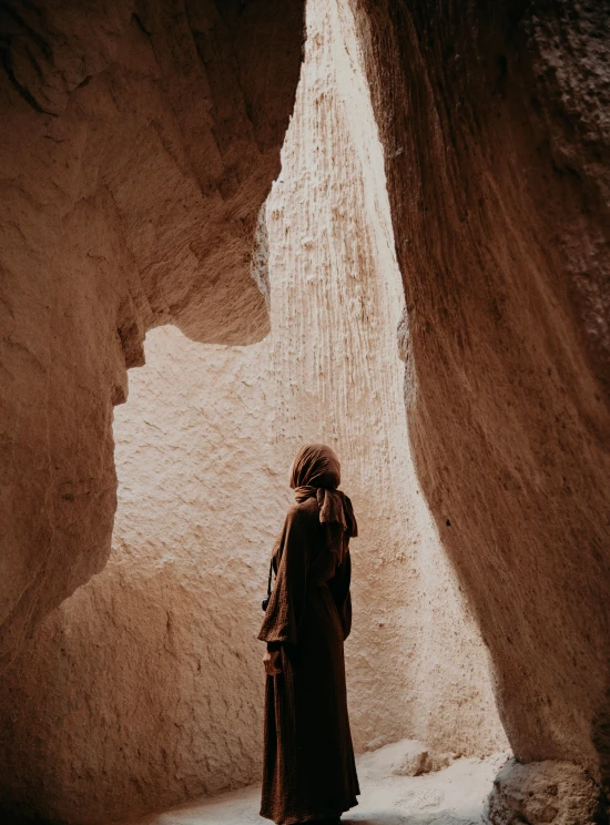 there is a woman standing in front of the water