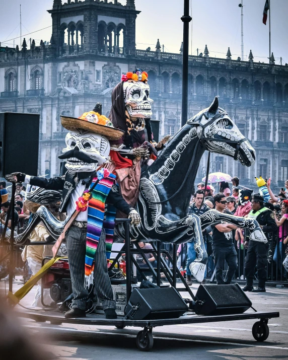 a skeleton is sitting in the middle of a parade