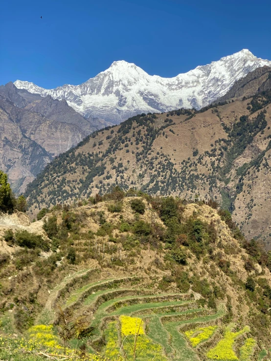 a mountain is shown with snow capped peaks