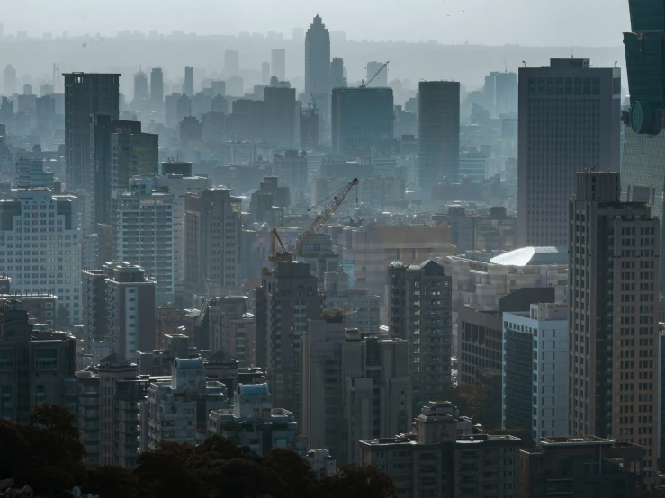 a city skyline covered in tall buildings under construction