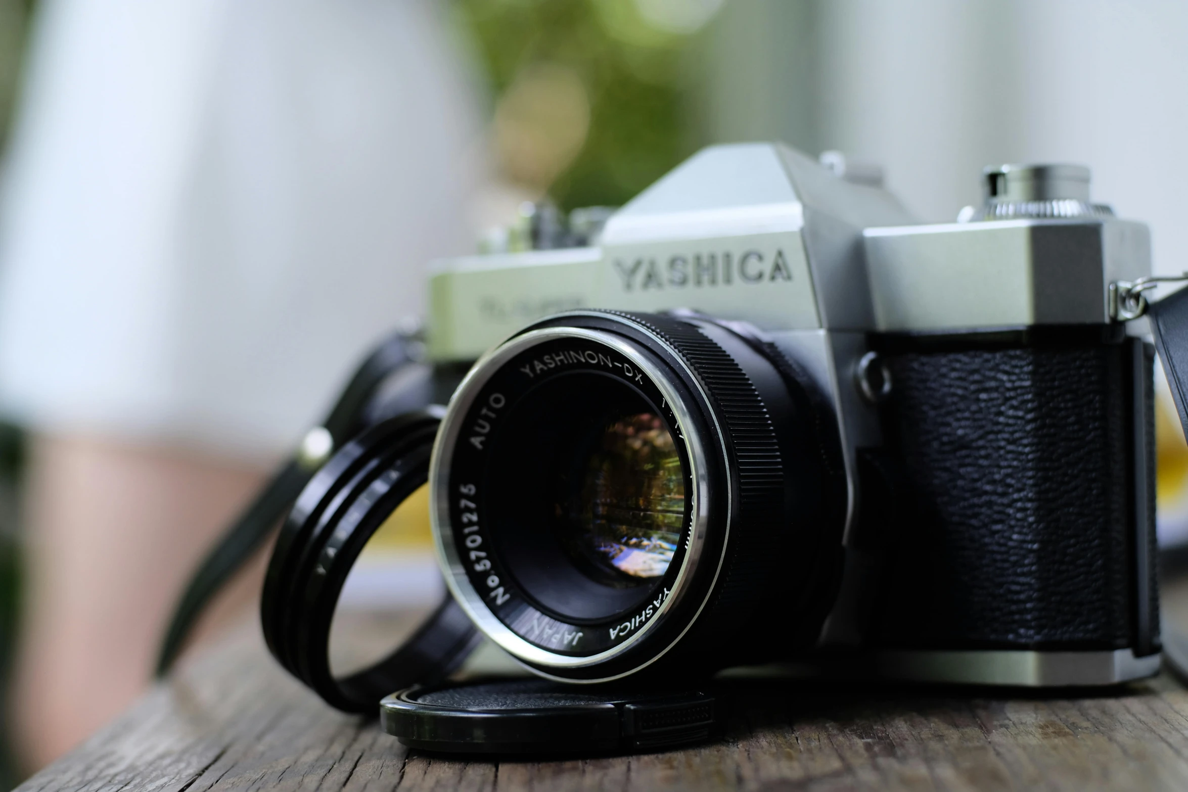 a camera sitting on top of a wooden table