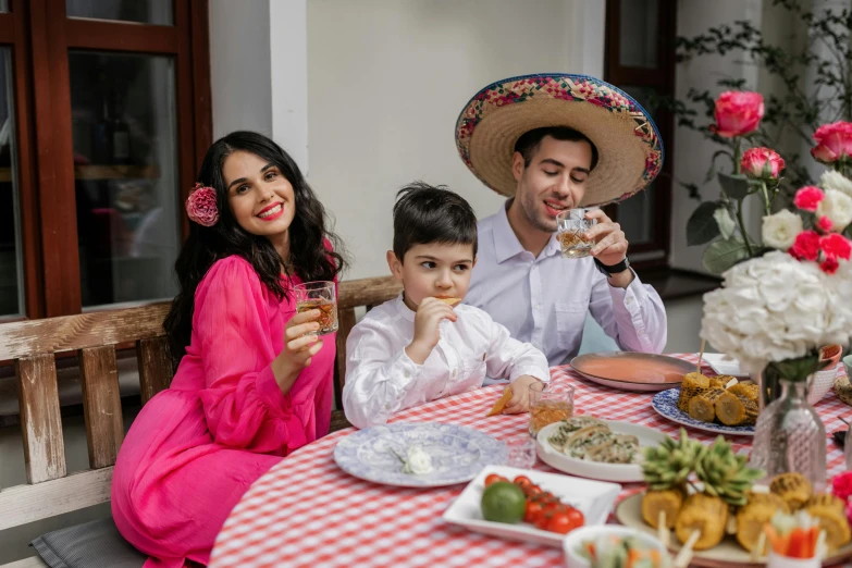 a family wearing mexican costumes at the table