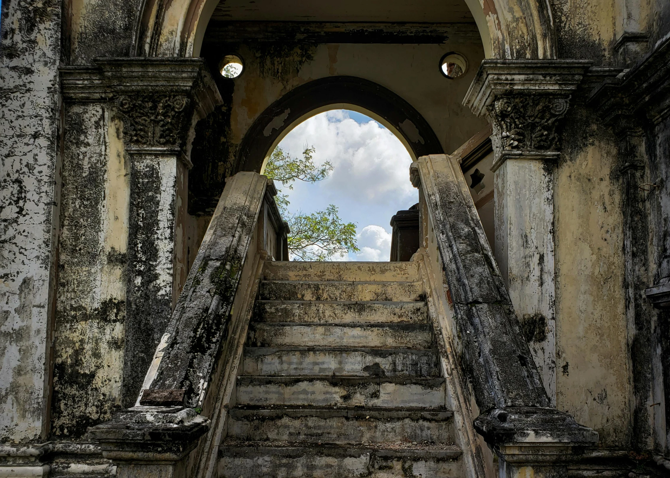 the entrance to an old church with stairs