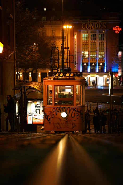 a trolley that has graffiti on the side of it