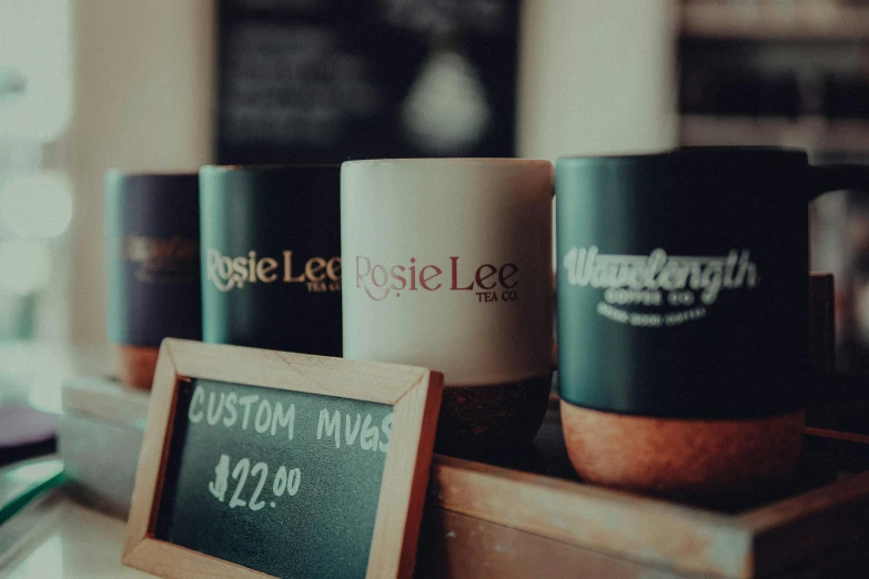 coffee cups are sitting on a counter top