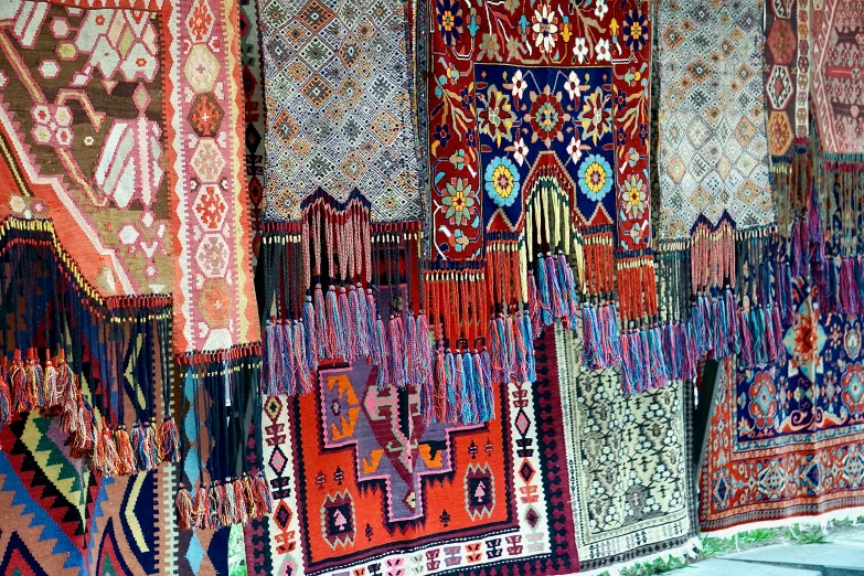 a room full of different rugs and carpets