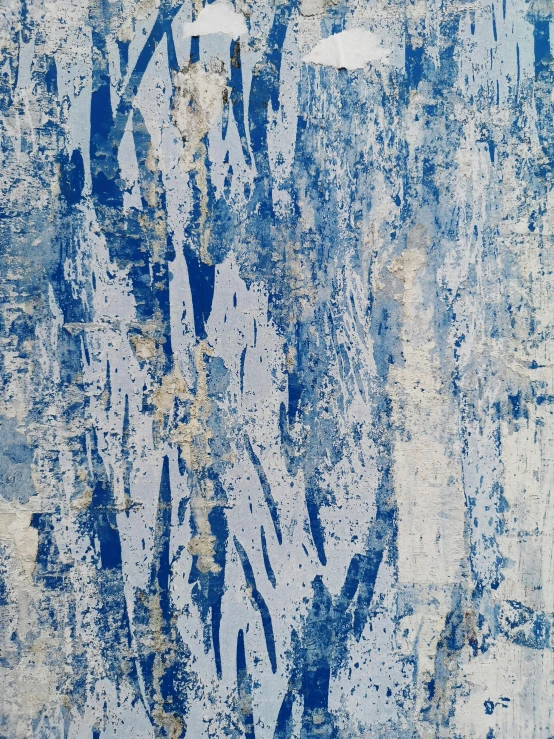 a blue and white artwork that has faded lines