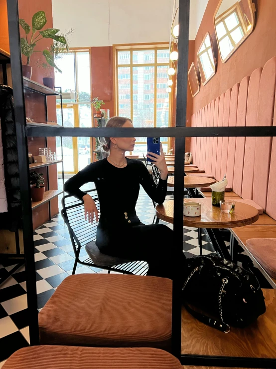 a woman sitting down while having a meal