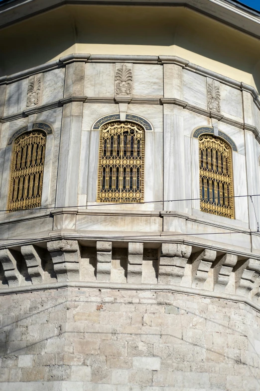 an ornate window design in the corner of a building