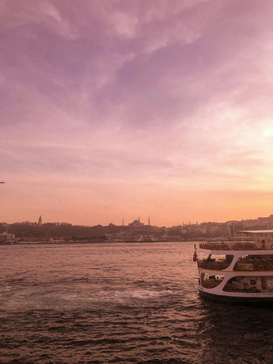 four large ships are traveling on the water