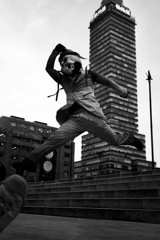 a person jumping in the air near a building