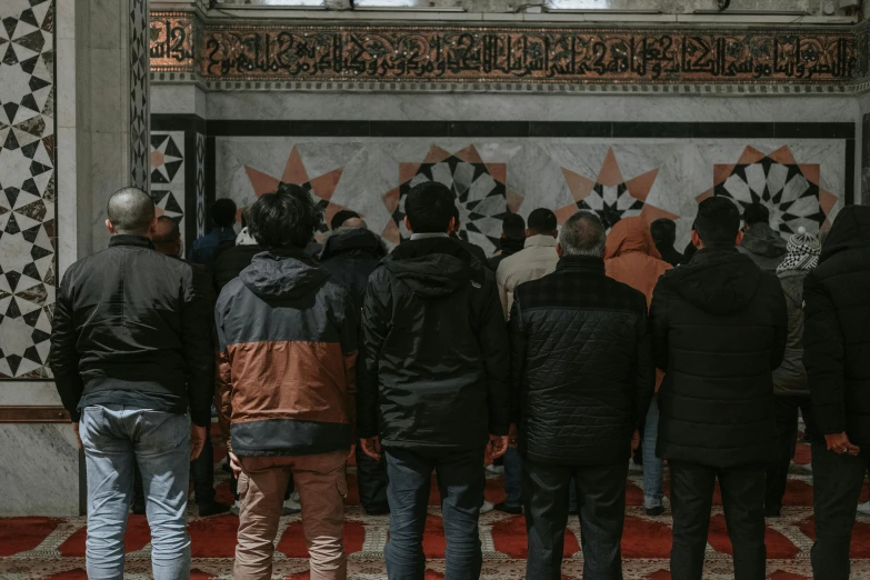 a group of people standing in a room