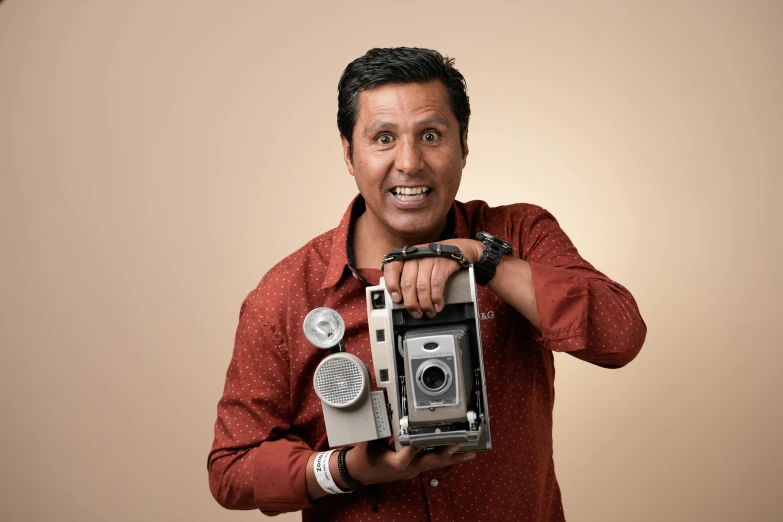 a person in red shirt holding a camera