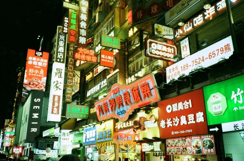 a city street with many colorful signs all around