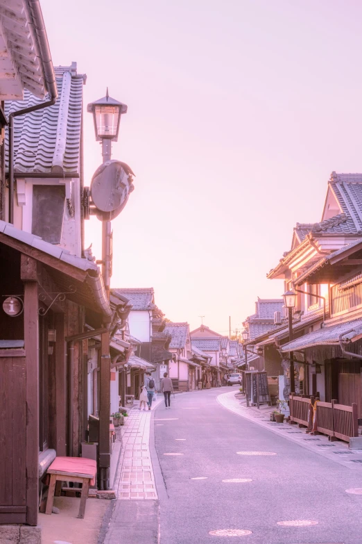 an empty street lined with houses on either side