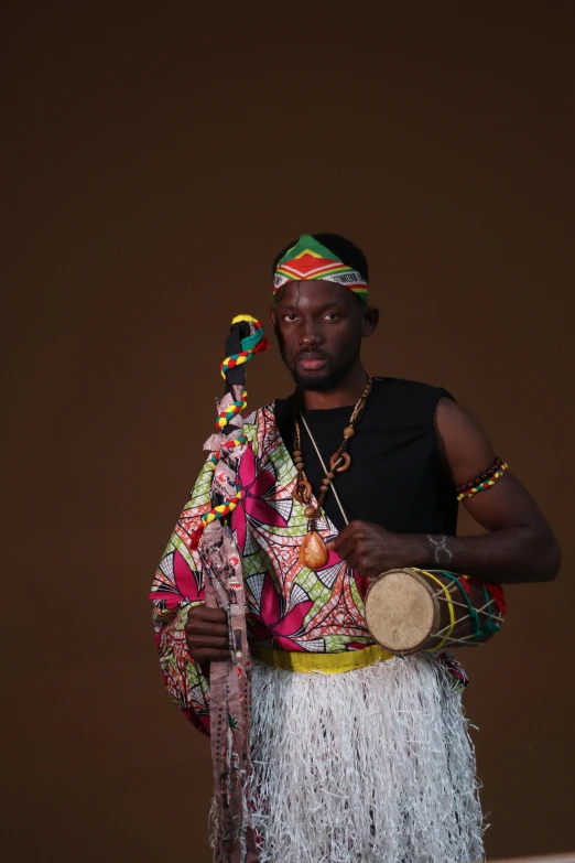 man holding a musical instrument and clothing,