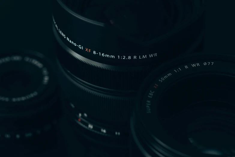 two large digital cameras sitting side by side