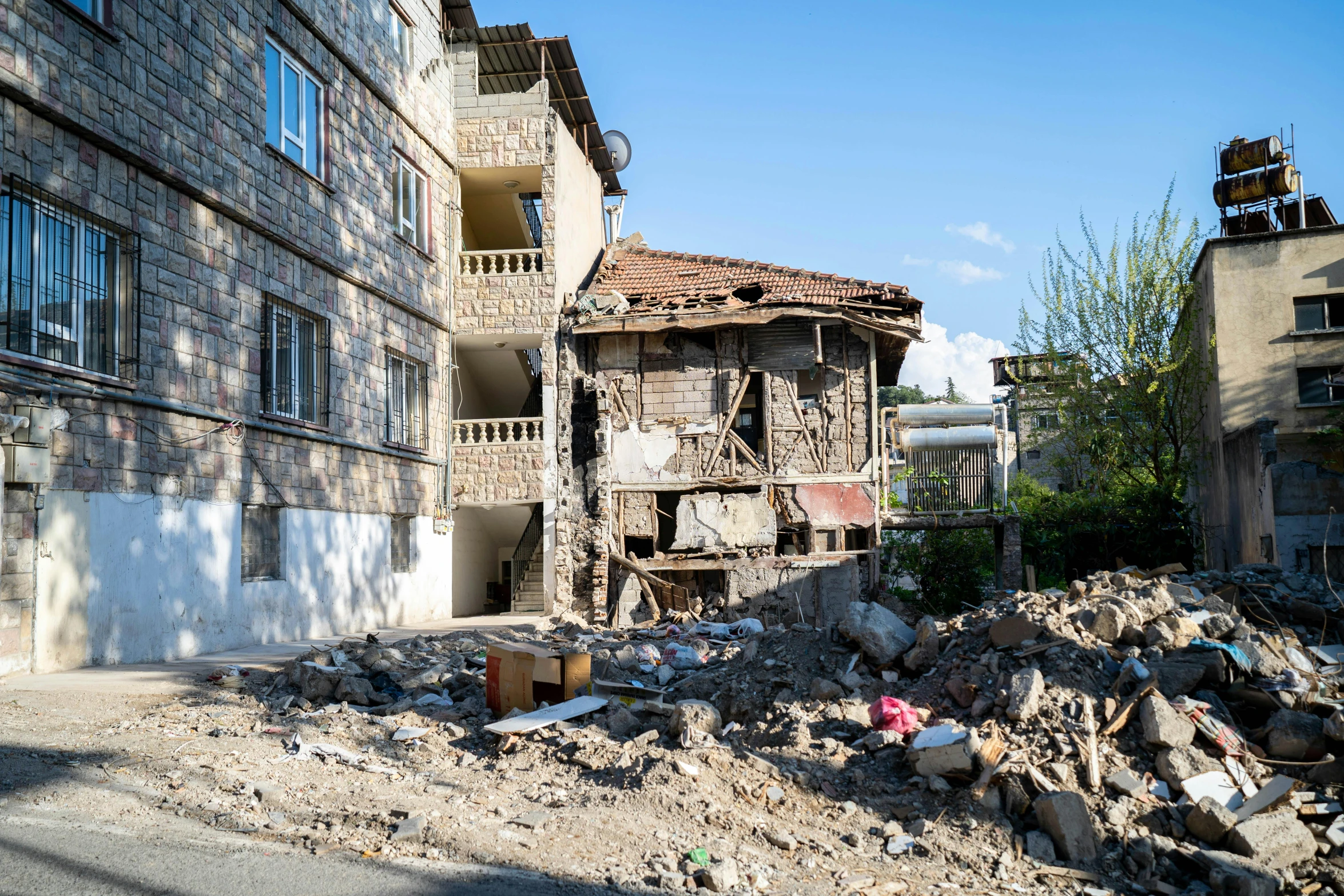 some rubble in front of some old buildings