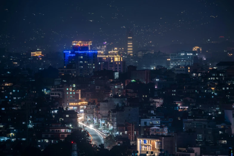 a city at night with lights on the buildings