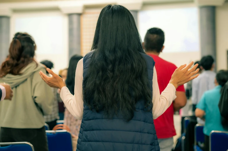 a woman with her arms up in the air