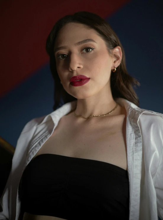 woman with dark lipstick wearing a black and white outfit