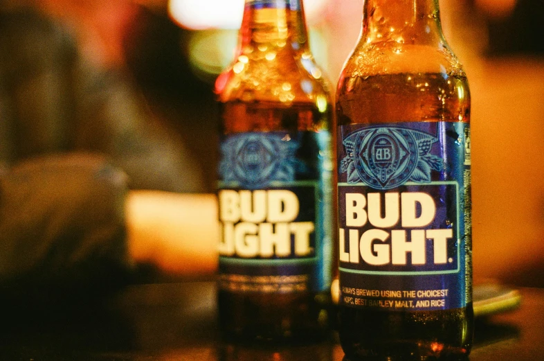 two beer bottles with bud light on the inside