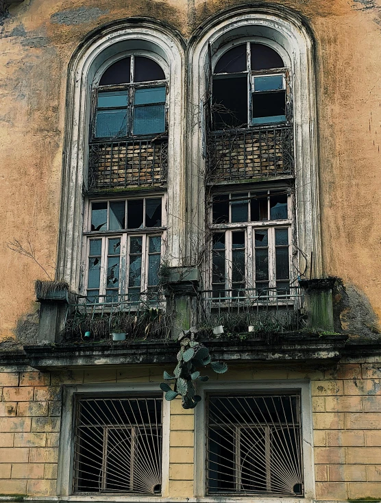 two very old window styles next to each other