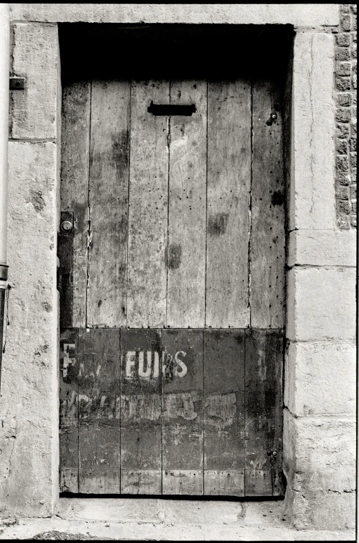 an old door is in a stone building