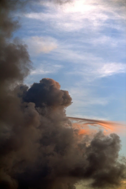 two planes are flying through the sky in the afternoon