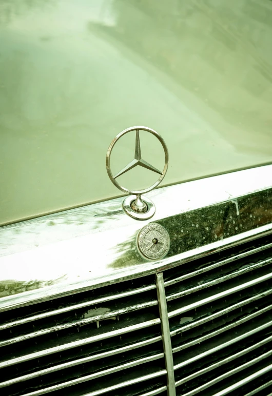 the emblem on a mercedes benz benz automobile
